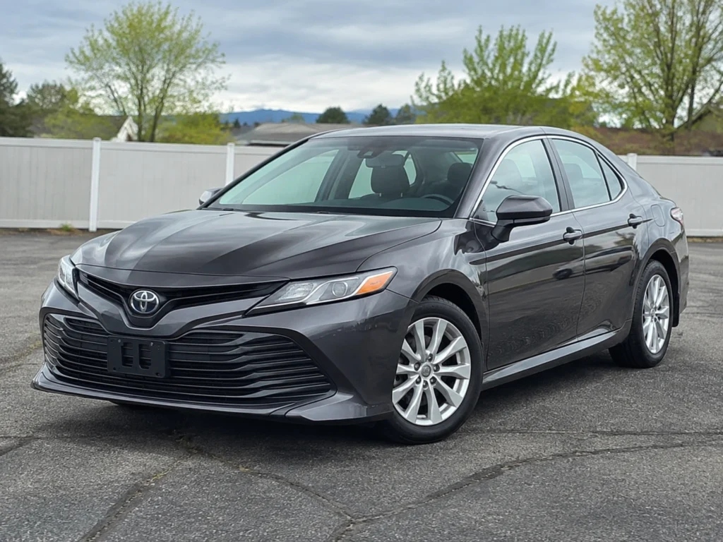 Temporary AI-generated illustration of a 2019 Toyota Camry, front three-quarter view. Not a photograph of the actual vehicle for sale.