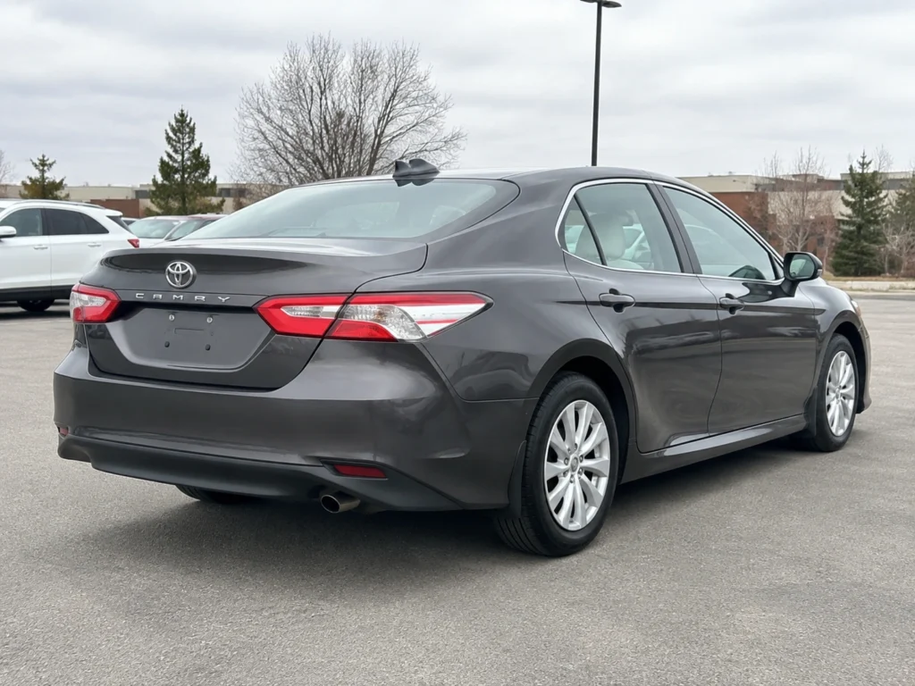 Temporary AI-generated illustration of a 2019 Toyota Camry, rear three-quarter view. Not a photograph of the actual vehicle for sale.